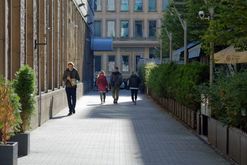 7 - A bustling pedestrian street with several people walking in Warsaw